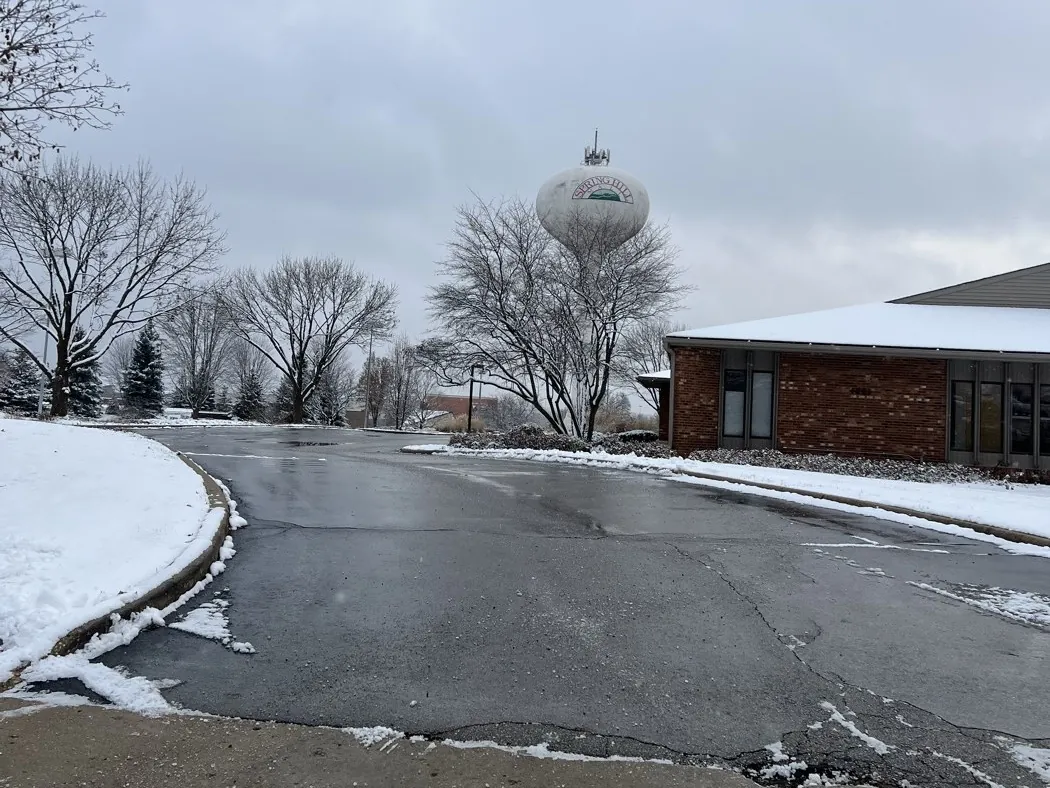 A cleared commercial parking lot near the Spring Hill water tower in West Dundee