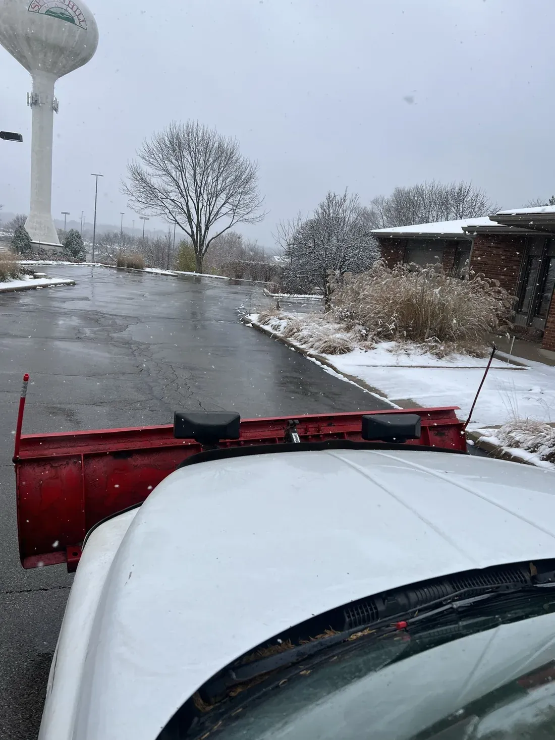Arctic Fox plow truck on a cleared commercial property in the Fox Valley
